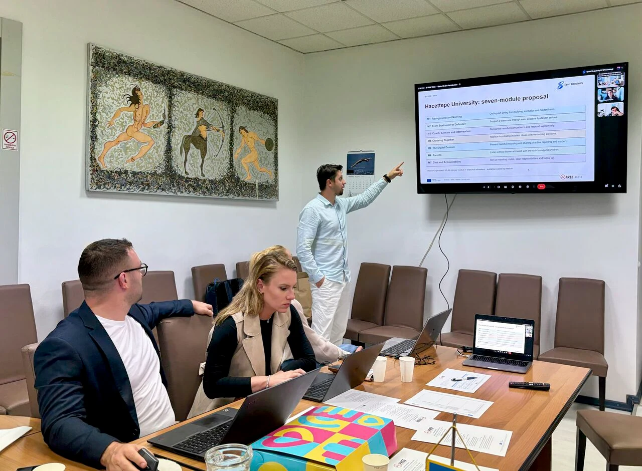 B-FREE meeting participants in Rijeka discussing a proposed training programme displayed on screen.