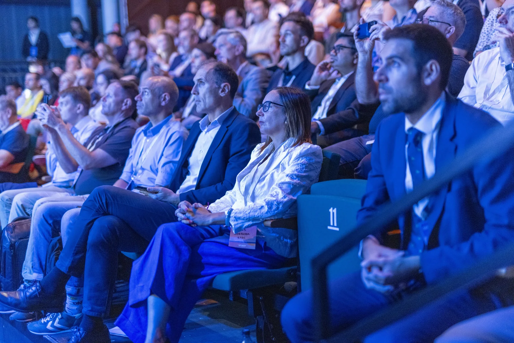 Participants listening to a session in the GSIC Summit auditorium.