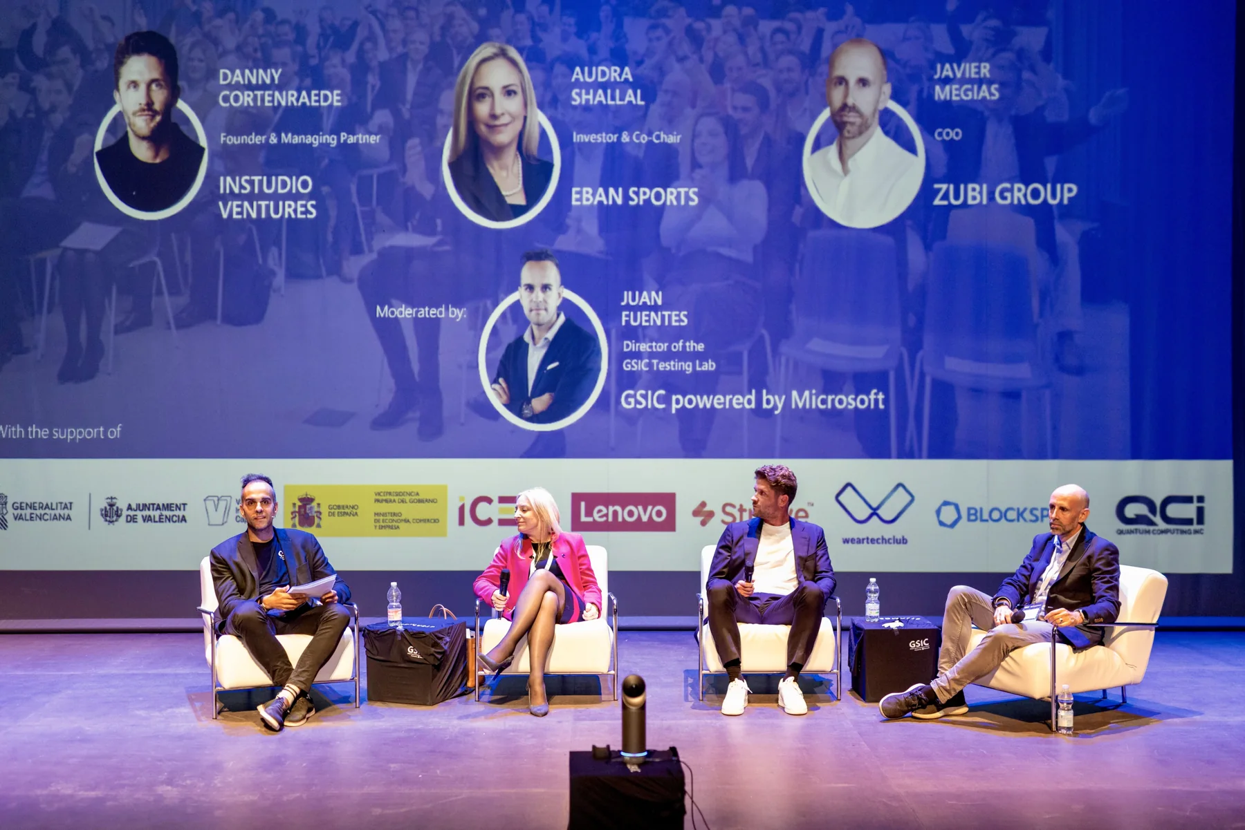 Four panellists on stage during a discussion on investment in sports technology.
