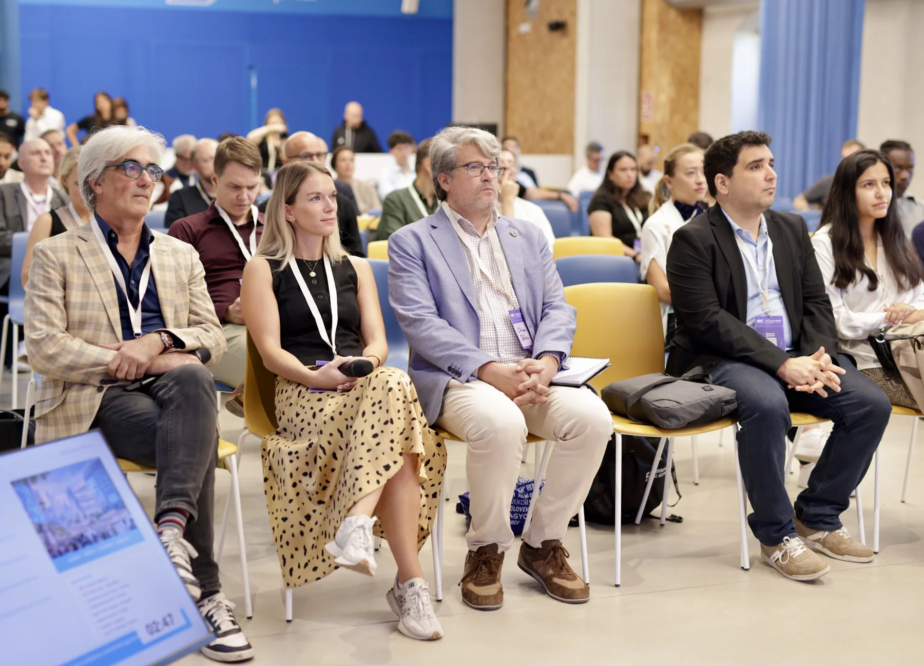 Participants listening from the front rows of the workshop room.
